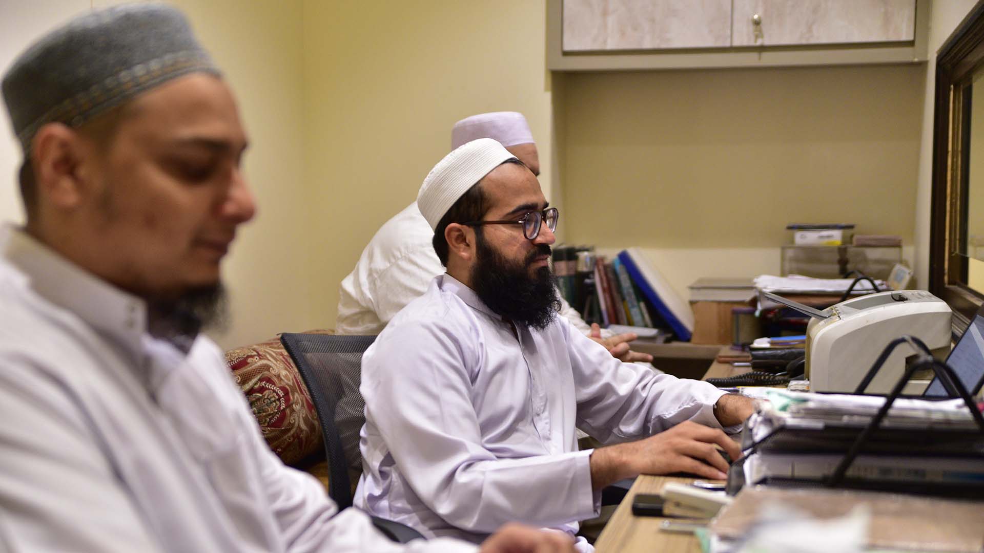 Mufti checking references for fatwa in Binoria